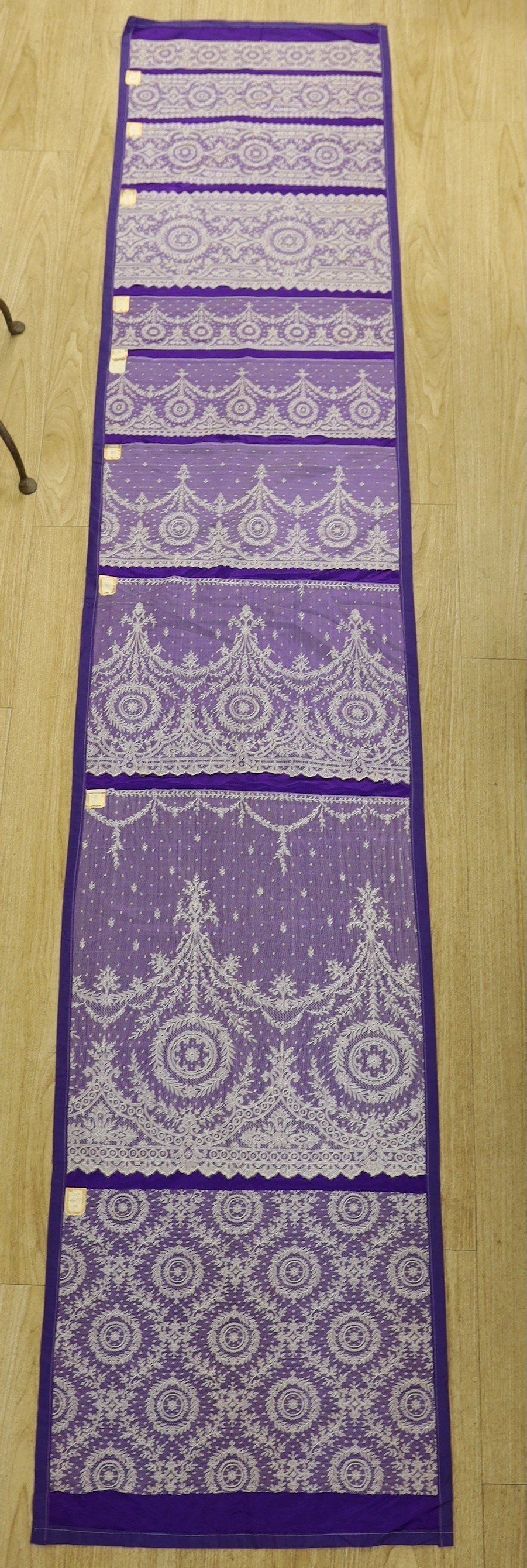 A late 19th, early 20th century retail sample display of various lace designs